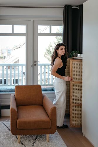 professional home organizer standing at wardrobe