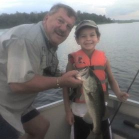Capt Dick Loupe of the Southern Outdoorsman Guide Service teaching a young fellow how to bass fish.