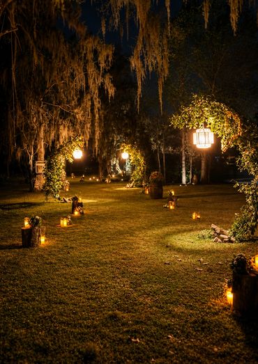 Illuminated path leading to the venue.