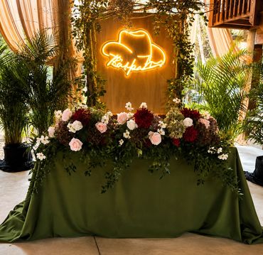 Sweetheart table with custom backdrop.