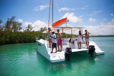 Group enjoying a private trip on clear water.
