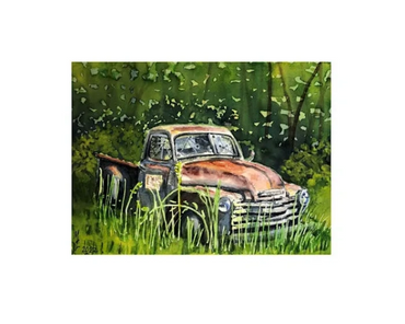 A abandoned, rusted, grey truck sits in an overgrown field