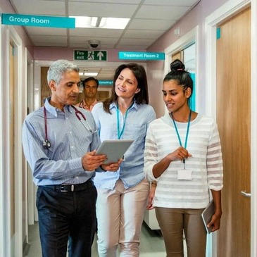 Healthcare professionals discussing results from recent research on measuring metabolic rates.