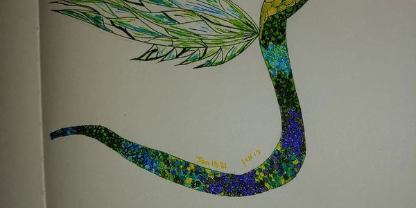 Colorful snake with intricate patterns and wings.