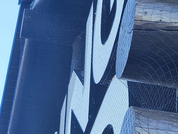 signs can be netted off to keep birds out