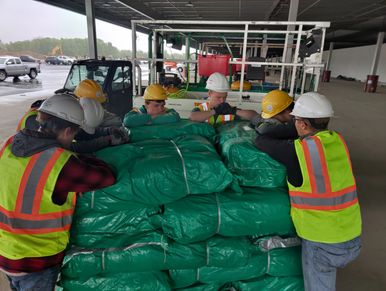 crew of guys praying before the job starts for the day