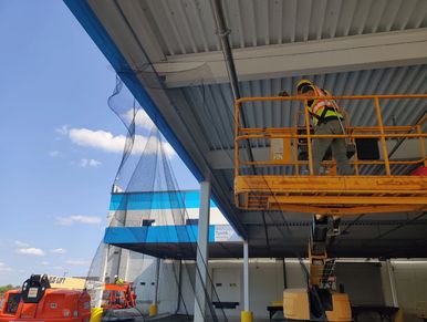 installation of the bird netting to the rafter area