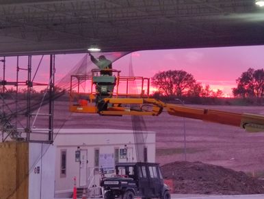 beautiful sunset as the guys are putting finishing touches on the bird netting installation