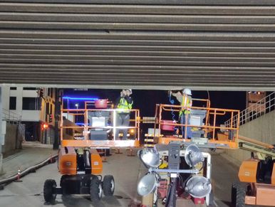 workers getting ready to work on a bridge