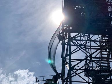 bird net is being installed on this tower