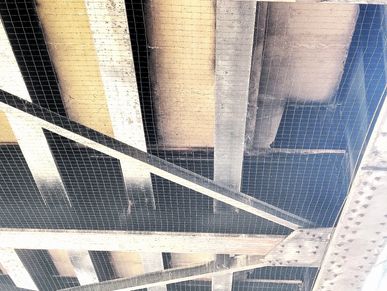 railroad bridge secured from getting pigeons in it