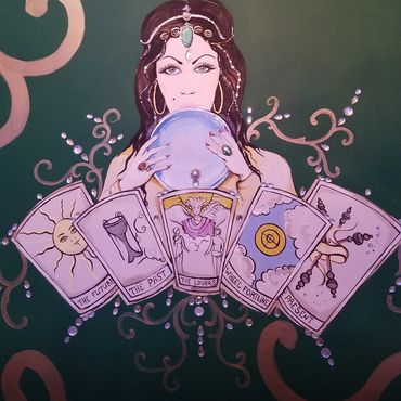 Psychic Woman Holding Tarot Cards and Crystal Ball.