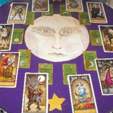 Mystical Tarot Card Layout With a Large Moon Illustration in the Center.