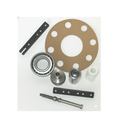 Various mechanical parts including bearings, spacers, and metal strips arranged on a white surface.