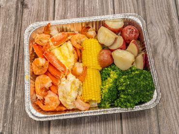 #34 has it all—crab, shrimp, and a succulent lobster tail! Indulge in the ultimate seafood feast.