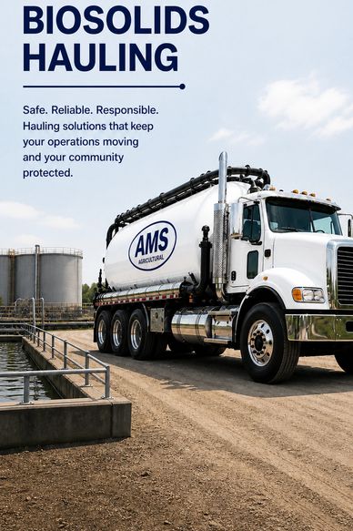 White AMS Agricultural biosolids hauling truck on a dirt path near storage tanks.