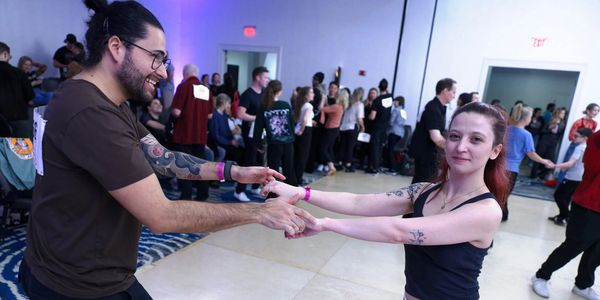 A couple dancing together indoors.
