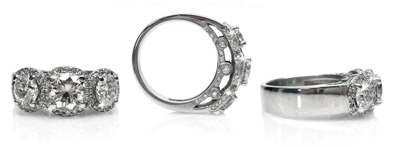 custom made three diamond with halo and diamond accent ring
