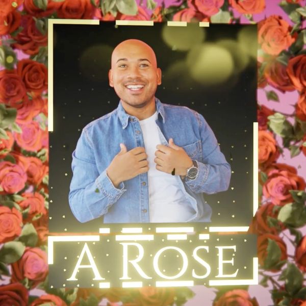 Tyler posing in a picture surrounded by roses. "A Rose" is in bright letters below his picture.