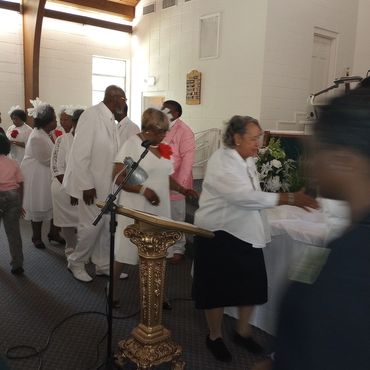 Leading fellowship after The Lord's Supper: Sister Evernell Bradley, Sister Susie Murray, Deacon Wil