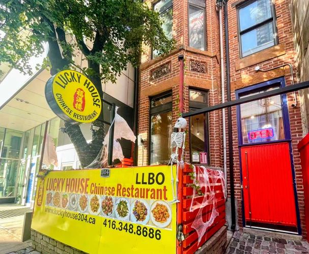 Lucky House Chinese Restaurant with Halloween decorations outside.