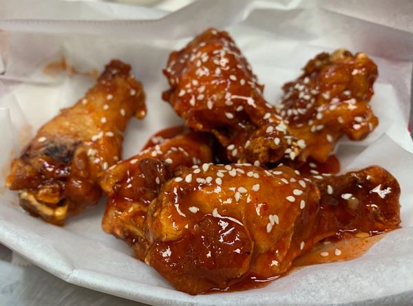 Shanghai Sizzle sauce bone-in wings at Golden Flame Hot Wings