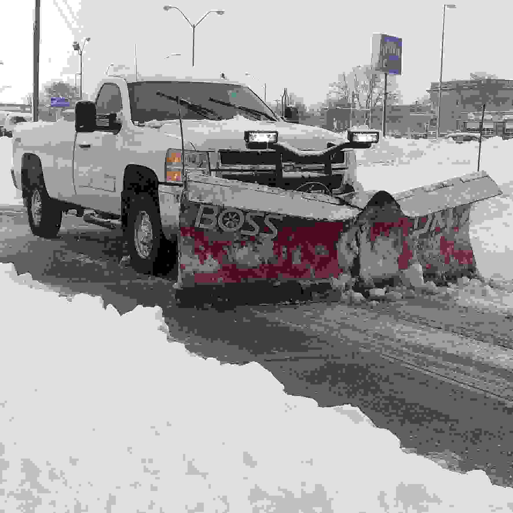 Plow truck plowing snow
