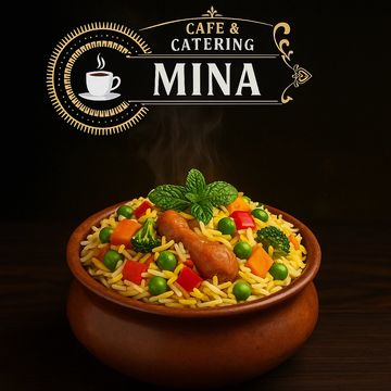 A bowl of colorful vegetable rice with chicken, garnished with mint leaves.
