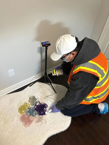 Performing a high-risk item radiation check to ensure safety.