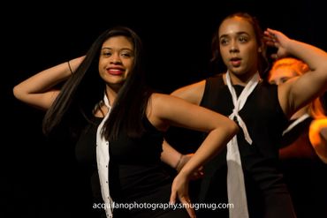 Sing-Out dancers perform on stage.
