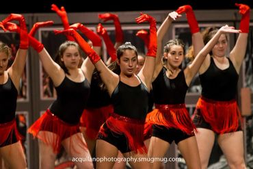 Sing-Out dancers perform on stage.