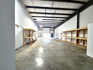 Over 2K SF of Warehouse space with ground level acess, 12 x 12 roll up door, 18' ceiling clearance