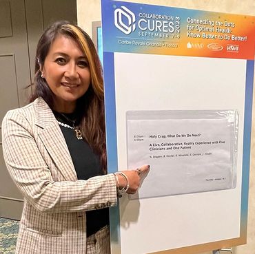 Woman presenting with white board.