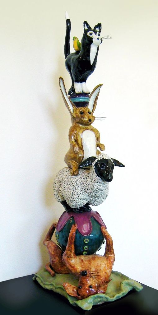 Old Dog New Trick is a totem of stacked animals. A dog, sheep, rabbit, cat and bird.