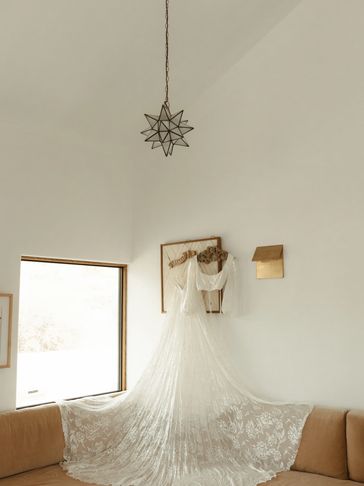 Elegant lace wedding dress with a long train displayed in a bright, minimalistic room.
Costa Rica Wedding Planner
Destination Wedding Planner
Joshua Tree Wedding Planner
Luxury Wedding Planning