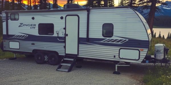 Parked Zinger Lite camper at sunset.