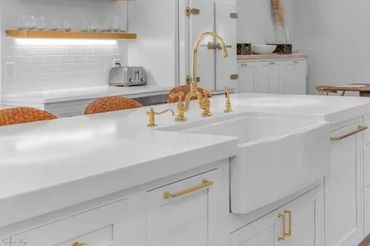 Apron sink installed into the island.