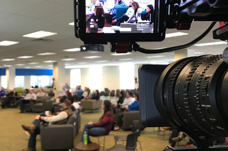 Live streaming town hall from behind the camera lens. Camera operator