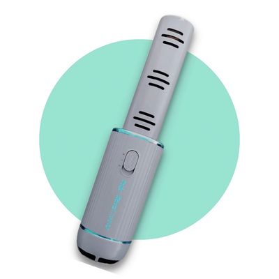 Portable air purifier with sleek design and ventilation slots.
