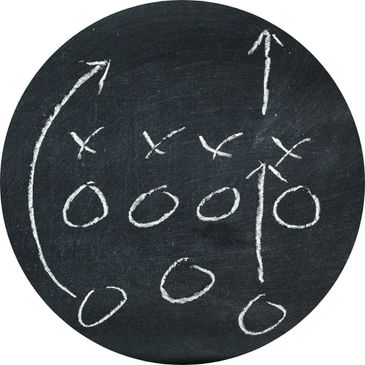 Chalkboard with Xs and Os football strategy map