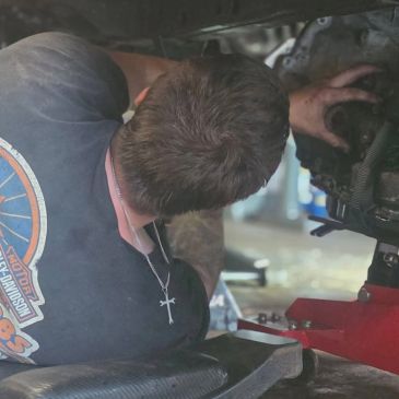 Mechanic working under a vehicle.