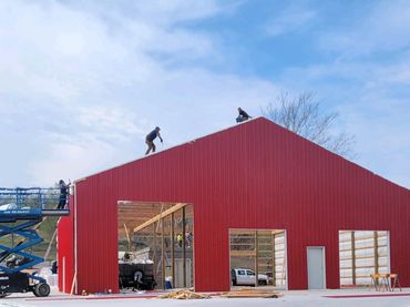 wood frame house designed with SmartBuild covered in metal with windows and doors