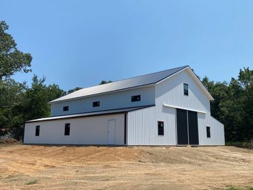 Post frame building covered in metal