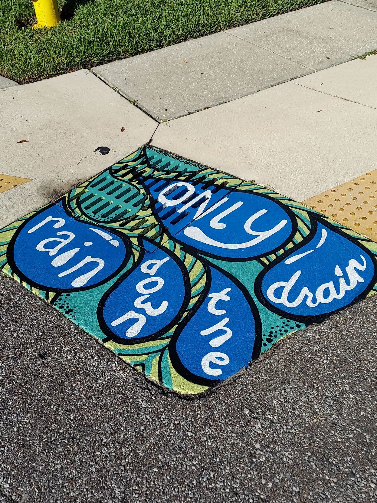 Storm Drain painted with large water drops, Only Rain Down the Drain project in Pinellas Park, Fl