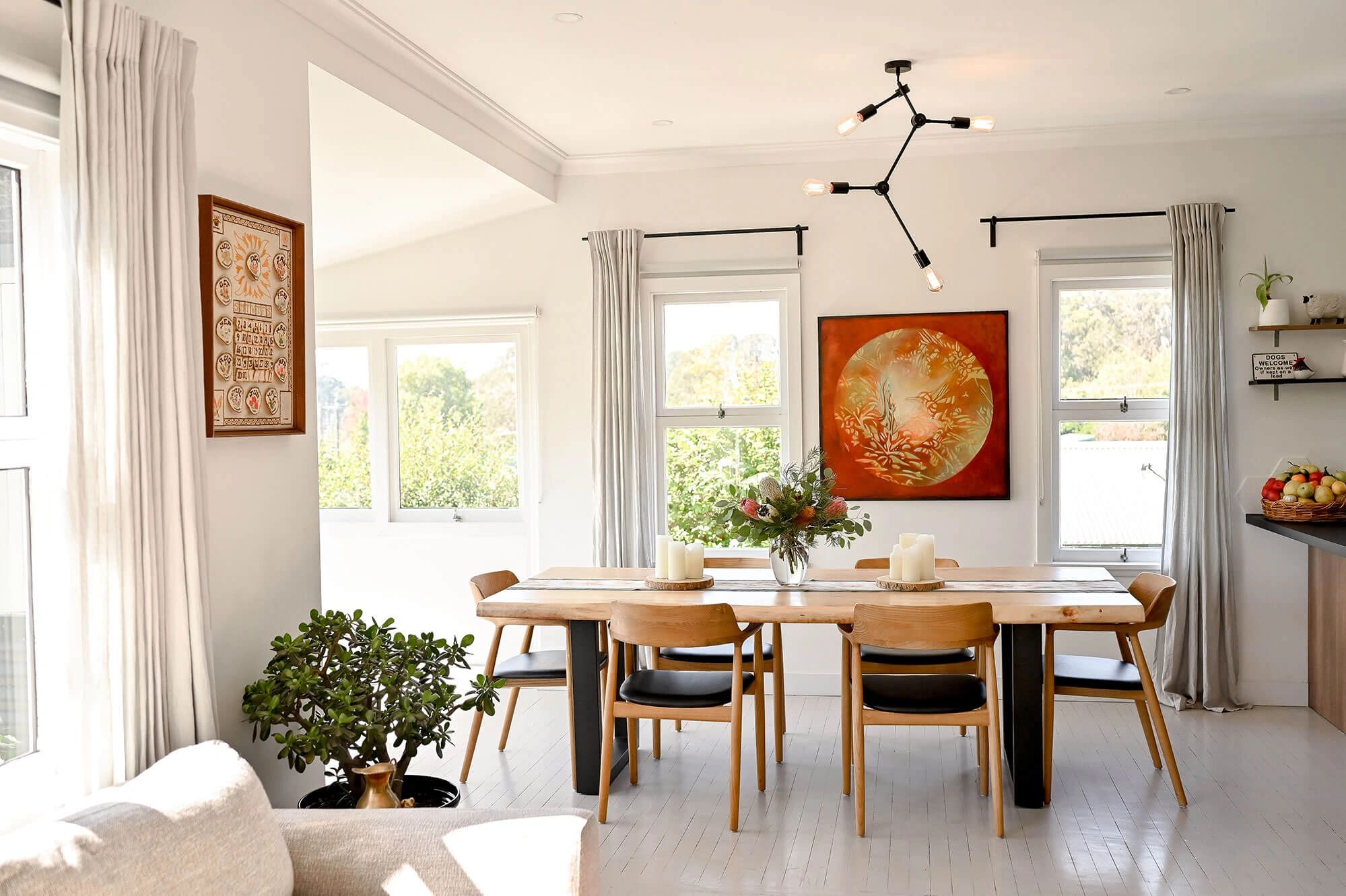 Bright and light dining room with timber furniture