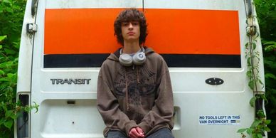 Nathan (our friend) in front of a white and orange van. Used in the collage for 'Terracotta' cover