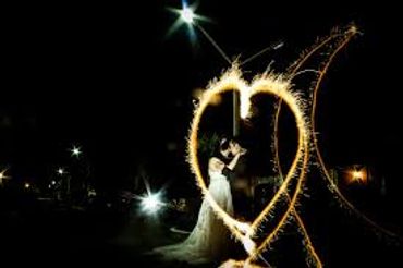 Heart shaped sparklers light up the nights sky.