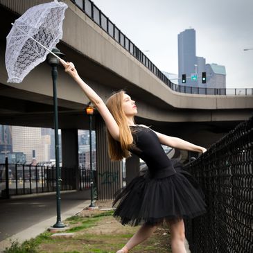 Preschoolers and toddlers dancing in the living room along with storyteller.