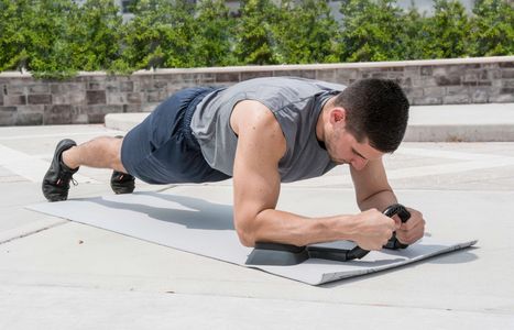 The abmill plank trainer assists in creating perfect form while planking when working out your abs.