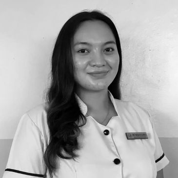 Portrait of a smiling woman in uniform.